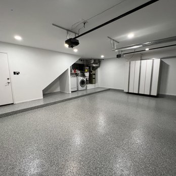 Cal Jackson Construction - a garage with a washer and dryer - Painters Near Me