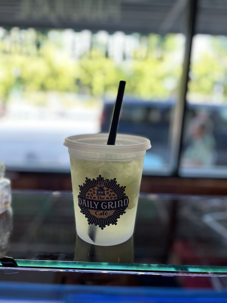 The Daily Grind Cafe Logo