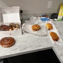 Yummy Donuts - 2 sausage rolls, one egg, sausage, cheese croissant, 2 blueberry cake, one sprinkle , one cinnamon roll, one apple fritter for $14.37.
