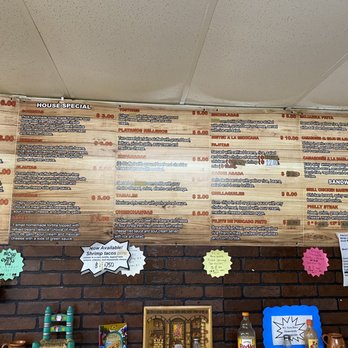 Alvarez Authentic Latin Food 2 - a menu on a brick wall - Tacos Near Me - Tampa, Florida Alvarez Authentic Latin Food 2 - a menu on a brick wall - Tacos Near Me - Tampa, Florida