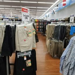 a variety of men's clothing in a store