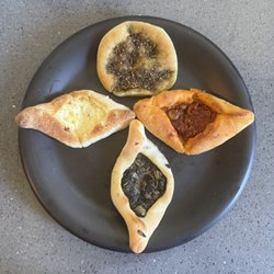 Patisserie Mahrousé - Pâtisserie Mahrousé's delicious savory Fatayer variety (Tomato with Olives, Spinach, Cheese, and round Za'atar)!!!