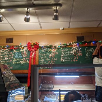 Dama Bakery - a woman standing in front of the counter - Bakeries Near Me - Arlington, Virginia
