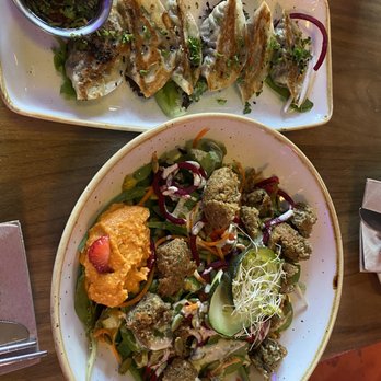 Nourish Bistro - Delicious little warm gyoza and a fresh herb falafel salad! - Vegan Near Me - Banff, Alberta Nourish Bistro - Delicious little warm gyoza and a fresh herb falafel salad! - Vegan Near Me - Banff, Alberta