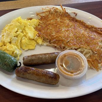 Rodeo Cafe - Scrambled eggs, sausage, amazing hash browns, a roasted jalapeño and a small container of their homemade salsa. - Breakfast & Brunch Near Me - Temecula, California Rodeo Cafe - Scrambled eggs, sausage, amazing hash browns, a roasted jalapeño and a small container of their homemade salsa. - Breakfast & Brunch Near Me - Temecula, California