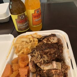 Jerk chicken with Mac and cheese / yams. Jamaican drinks Jerk chicken with Mac and cheese / yams. Jamaican drinks