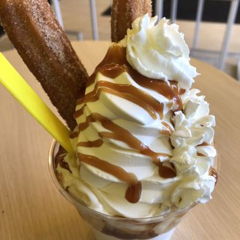 Churn Soft Serve - Caramelicious (vanilla soft serve, bananas "Foster style", whipped cream) + two churros - Coffee & Tea Near Me - Buffalo, New York Churn Soft Serve - Caramelicious (vanilla soft serve, bananas "Foster style", whipped cream) + two churros - Coffee & Tea Near Me - Buffalo, New York