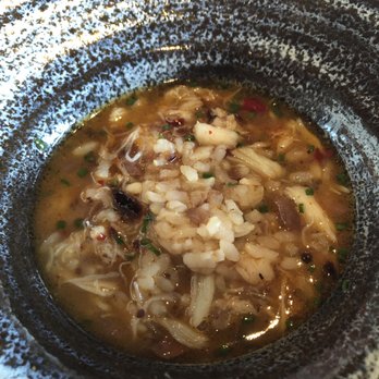 Canlis - Haiga Rice in brown butter dashi with Dungeness crab, fried chili, and hazelnuts - New American Near Me - Seattle, Washington Canlis - Haiga Rice in brown butter dashi with Dungeness crab, fried chili, and hazelnuts - New American Near Me - Seattle, Washington