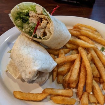 Keith's Oaks Bar & Grill - Ceasar chicken wrap includes fries. - Seafood Near Me - Brandon, Florida