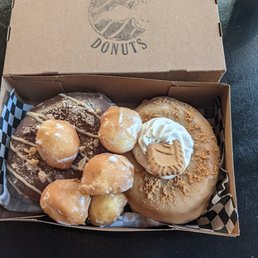Reese's PB Cup & Cookie Butter donuts. Clerk threw in a few donut holes!