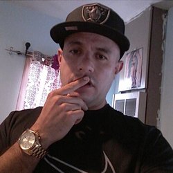 Me with a black hat and a black t shirt also a wrist watch