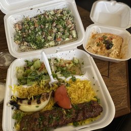 Kefta kabob (2 skewers but ate one before this photo, it would be where the fork is) ; Hummus ; Jerusalem salad Kefta kabob (2 skewers but ate one before this photo, it would be where the fork is) ; Hummus ; Jerusalem salad