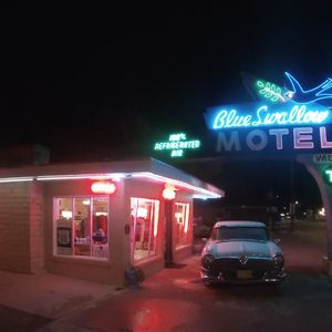 Photo of Blue Swallow Motel - Tucumcari, NM, United States. Lit up at night
