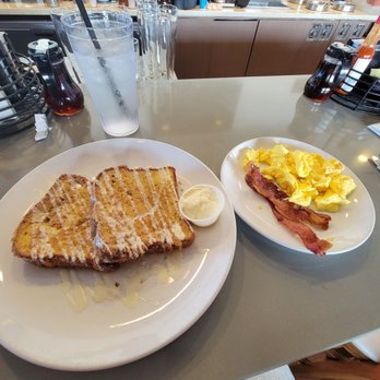 Broken Yolk Cafe - Churro French Toast w/ eggs and bacon. Usually comes with whipped cream that's delicious but I ask for none. - Breakfast & Brunch Near Me - Costa Mesa, California Broken Yolk Cafe - Churro French Toast w/ eggs and bacon. Usually comes with whipped cream that's delicious but I ask for none. - Breakfast & Brunch Near Me - Costa Mesa, California