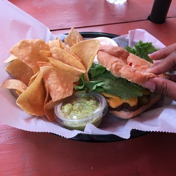 Cafe Lola - South of the Burger with tortilla chips and guacamole - Cafes Near Me - Lafayette, Louisiana Cafe Lola - South of the Burger with tortilla chips and guacamole - Cafes Near Me - Lafayette, Louisiana