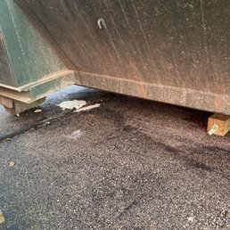 The driver put four 4x4 blocks to prevent or reduce damages to the driveway.