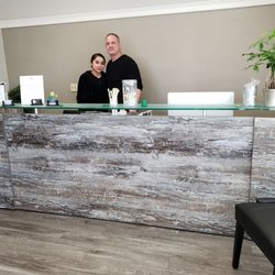 Casey Strand, DC - Strand Chiropractic - Dr. Strand and Stephanie in the reception area.