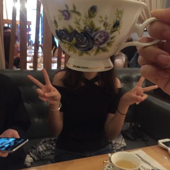 Prince Tea House - Best friend with teacup over her head - Tea Rooms Near Me - Flushing, New York