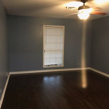 Floors On Up Remodeling Services - a room with hardwood floors and a ceiling fan - Flooring Near Me Floors On Up Remodeling Services - a room with hardwood floors and a ceiling fan - Flooring Near Me