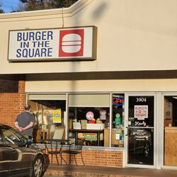Burger In The Square - The sign and entrance door of the restaurant.