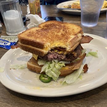 Bobbie's Southern Kitchen - A burger in between 2 Texas toast grilled cheese call the widow maker - American Near Me - San Antonio, Texas