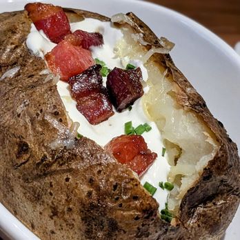 Bourbon & Bones Chophouse | Bar - Baked Potato with Pork Lardons - Steakhouses Near Me - Peoria, Arizona Bourbon & Bones Chophouse | Bar - Baked Potato with Pork Lardons - Steakhouses Near Me - Peoria, Arizona