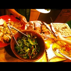 VLT Catering - Guests eager to get in on the fare at this casual, gourmet dinner party.
