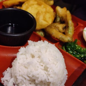 Mandarin Noodle House - a red tray with rice, onion rings, and other food items - Chinese Near Me - Johnston, Iowa