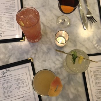 Ben Paris - Mezcal drink, tequila drink, and two whiskey drinks from front to back! - New American Near Me - Seattle, Washington