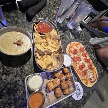 Topgolf - Queso blanco with chips, Mac & cheese balls & pepperoni flatbread - Golf Near Me - Roseville, California Topgolf - Queso blanco with chips, Mac & cheese balls & pepperoni flatbread - Golf Near Me - Roseville, California