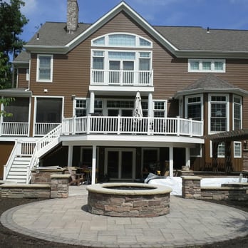 Custom Siding - a home with a deck and a fire pit - General Contractors Near Me - Burton, Ohio Custom Siding - a home with a deck and a fire pit - General Contractors Near Me - Burton, Ohio