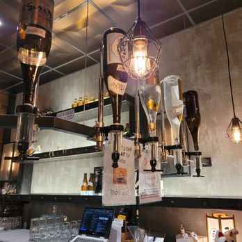 Yuchan Shokudo - Sake display shows off their collection and doubles as decor. - Ramen Near Me - Davis, California Yuchan Shokudo - Sake display shows off their collection and doubles as decor. - Ramen Near Me - Davis, California