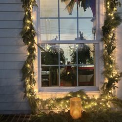 Uncle Bob's Florist & Garden Center - Mixed  evergreen mantle garland embellished with faux fruits , pinecones & large cylinder glass votive with battery operated candle