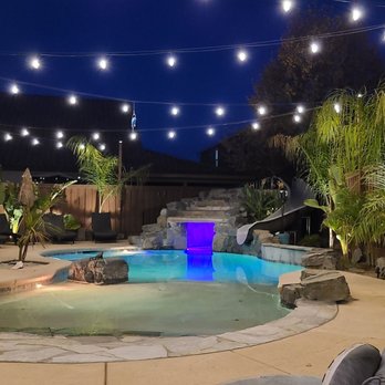 Premier Pools & Spas - Beach entry with sand finish. 6ft groto with waterfall, slide, and sheer descent. - Hot Tub & Pool Near Me - Salida, California