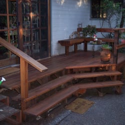 Kendall Home and Yard Florist & Nursery - Owner had an unusable 3 x 4 landing and steps. This low cost addition created an intimate seating area overlooking the back gardens.