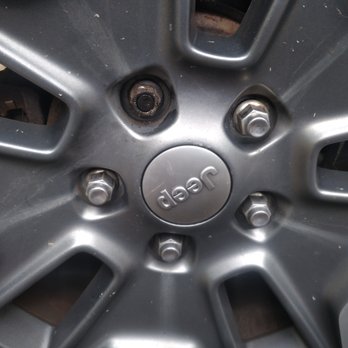 Mavis Discount Tire - Stripped lug nut, with cross-threaded lug nut to then right of it. - Tires Near Me - Freehold, New Jersey Mavis Discount Tire - Stripped lug nut, with cross-threaded lug nut to then right of it. - Tires Near Me - Freehold, New Jersey
