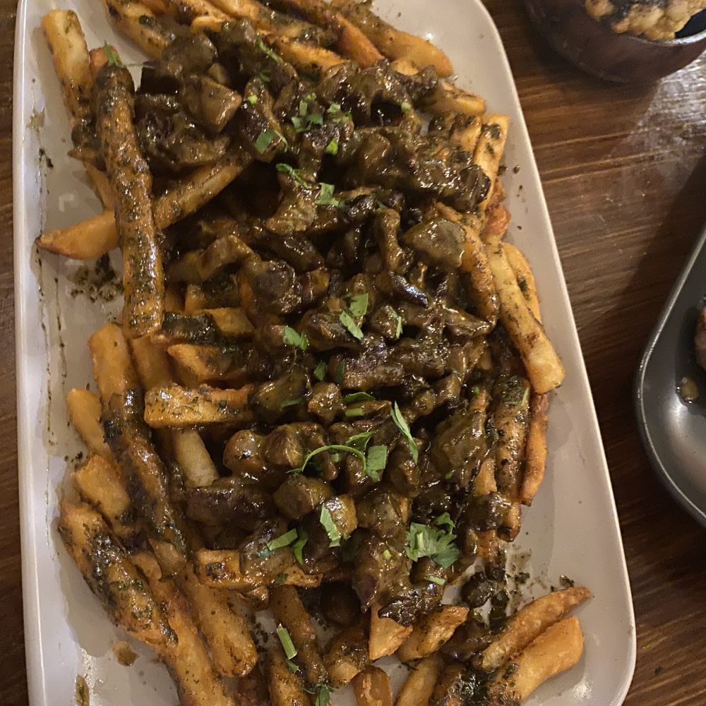 Frangos Peri Peri - Beef Bites (over fries) with lemon and herb. Tasty and a big portion - Portuguese Near Me - New York, New York Frangos Peri Peri - Beef Bites (over fries) with lemon and herb. Tasty and a big portion - Portuguese Near Me - New York, New York