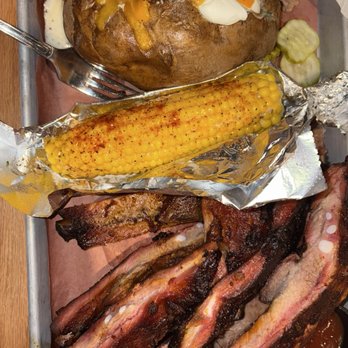 Jim 'N Nick's Bar-B-Q - 2lbs spare ribs with a baked potato (2.99 charge) and BBQ corn which should be called Kickin' BBQ because it'll get you - Barbeque Near Me - Savannah, Georgia Jim 'N Nick's Bar-B-Q - 2lbs spare ribs with a baked potato (2.99 charge) and BBQ corn which should be called Kickin' BBQ because it'll get you - Barbeque Near Me - Savannah, Georgia