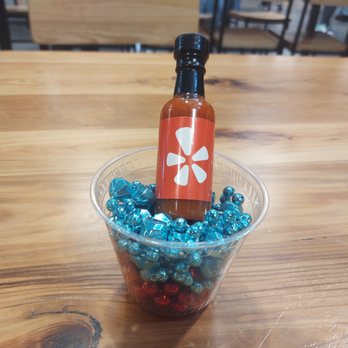 4 Hens Creole Kitchen - Yelp Elite promo. Hot sauce and Mardi Gras beads! - Cajun/Creole Near Me - St Louis, Missouri