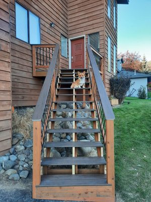 Split Story Deck Renovation - From rotten and risky to strong and stunning - rebuilt with pressure-treated lumber and Slate Gray Timbertech material.