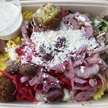 Sumac Mediterranean Grill - A bowl with saffron rice and salad topped with falafel, beef/lamb gyro meat, pickled onions, banana peppers, olives, and feta. - Mediterranean Near Me - Columbus, Ohio Sumac Mediterranean Grill - A bowl with saffron rice and salad topped with falafel, beef/lamb gyro meat, pickled onions, banana peppers, olives, and feta. - Mediterranean Near Me - Columbus, Ohio