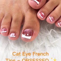 Nail Station and Lash & Brow Studio - Cat Eye sparkle meets classic French Tips The magnetic shimmer catches the light beautifully, while the crisp white tips keep the look cl