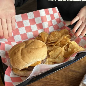 Springers - Plain cheeseburger with housemade chips. - American Near Me - Stoughton, Wisconsin