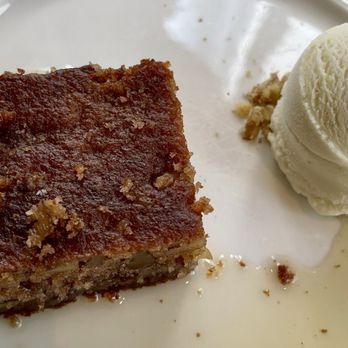 Estiatorio Milos - KARYDOPITA - Traditional Greek spiced walnut cake with honey lavender ice cream - Seafood Near Me - New York, New York Estiatorio Milos - KARYDOPITA - Traditional Greek spiced walnut cake with honey lavender ice cream - Seafood Near Me - New York, New York
