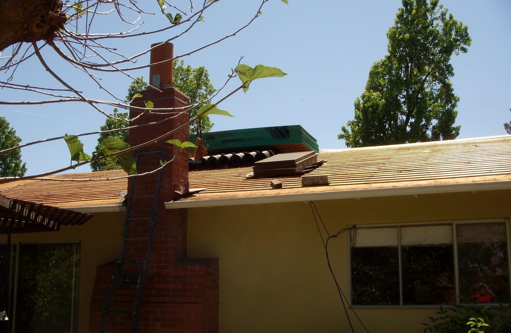 Slide of Signature Roofing