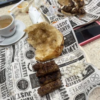 Balkan Cafe - Full portion of cevapi wiyh onion, kajmak and ajvar - Modern European Near Me - Jacksonville, Florida