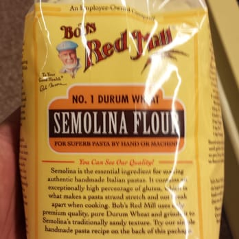 Publix - a hand holding a bag of semolina flour - Grocery Near Me - Rockledge, Florida
