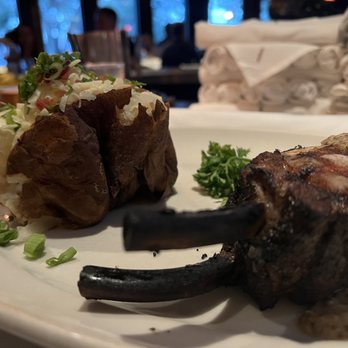 Hillstone Restaurant - Entree- pork chop with Dijon sauce and full potatoe - New American Near Me - Winter Park, Florida Hillstone Restaurant - Entree- pork chop with Dijon sauce and full potatoe - New American Near Me - Winter Park, Florida