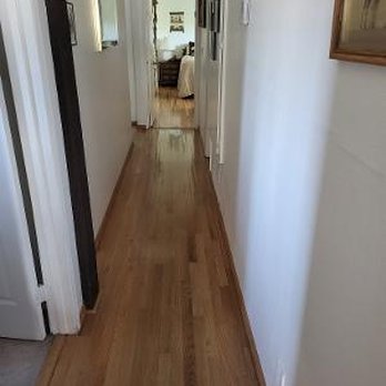 Iconic Floors & More - earlier wooded hallway and in background the matching wood in master bedroom - Flooring Near Me - Hemet, California