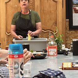 Ted Lare Design Build & Garden Center - Cooking instructor making a Mexican street corn side dish